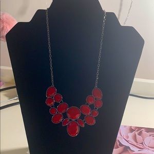 A red necklace with a matching pair of earrings ❤️